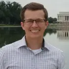 A headshot of Adam Daugeau.