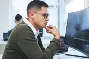 Man working on developing microapps.