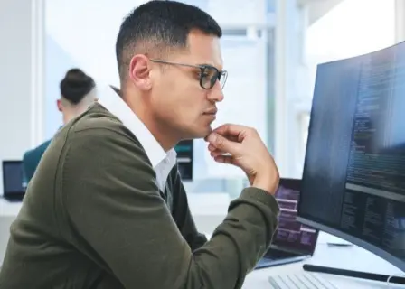 Man working on developing microapps.