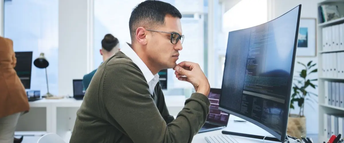 Man working on developing microapps.