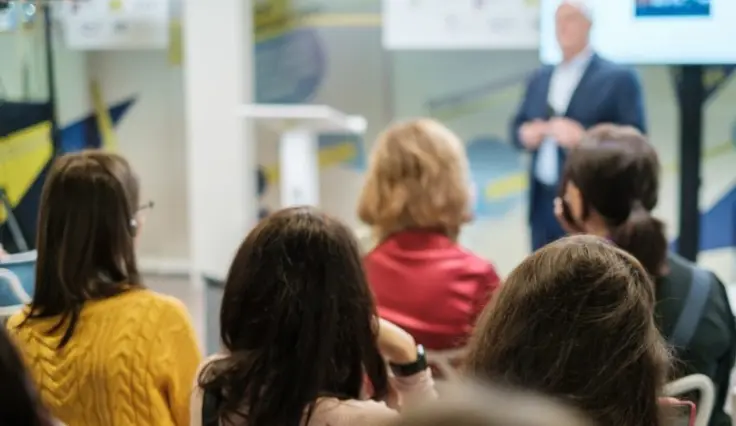 Audience watching presenter