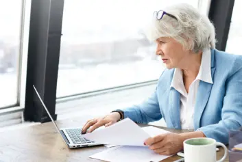 experienced manager working on laptop