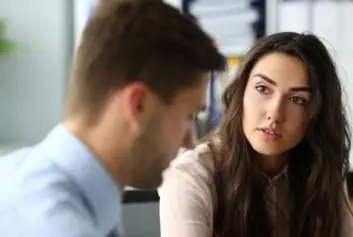 manager and employee having serious conversation