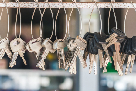 A Conceptual Image With Hanging Keys And One Shining Key. Many K A Conceptual Image With Hanging Keys And One Shining Key. Many K
